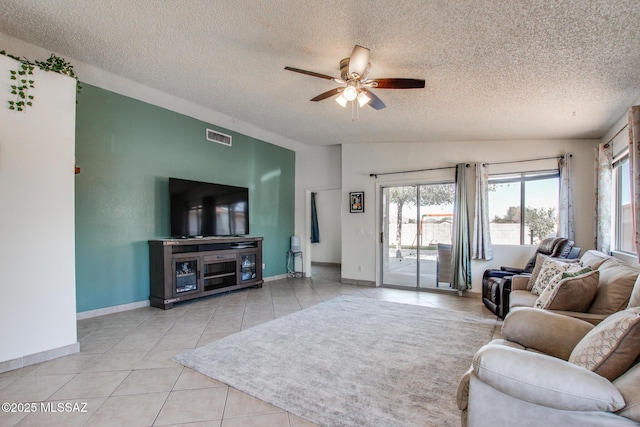 6075 N Applesauce Ct, Tucson, AZ 85741 - tiled living area with a textured ceiling and a ceiling fan