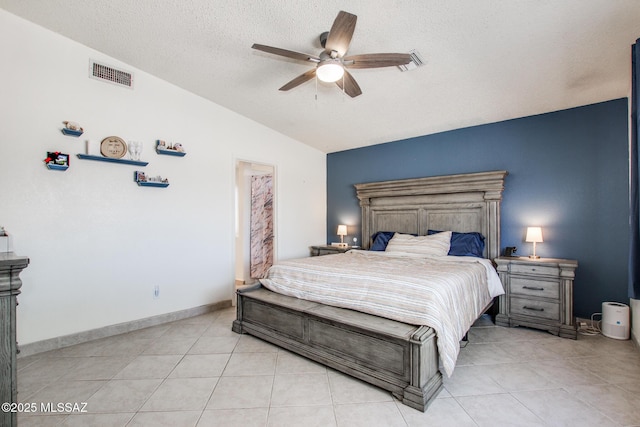 6075 N Applesauce Ct, Tucson, AZ 85741 - bedroom with vaulted ceiling, a textured ceiling, light tile patterned floors, and ceiling fan