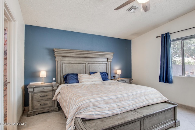 6075 N Applesauce Ct, Tucson, AZ 85741 - bedroom with light tile patterned floors, a textured ceiling, and a ceiling fan