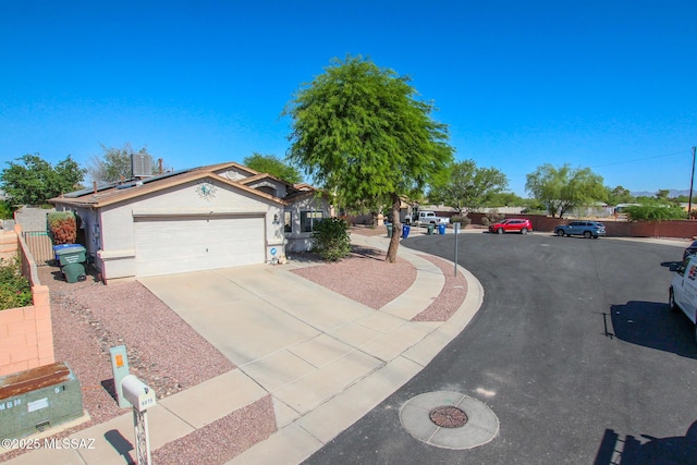 6075 N Applesauce Ct, Tucson, AZ 85741 - ranch-style house featuring solar panels, concrete driveway, and a garage