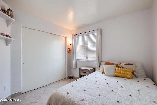 6075 N Applesauce Ct, Tucson, AZ 85741 - bedroom with light tile patterned flooring and a closet