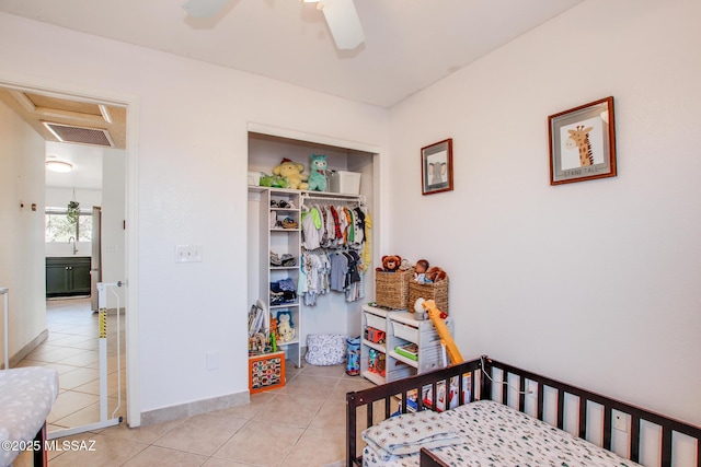 6075 N Applesauce Ct, Tucson, AZ 85741 - bedroom featuring tile patterned floors, a closet, attic access, and a ceiling fan