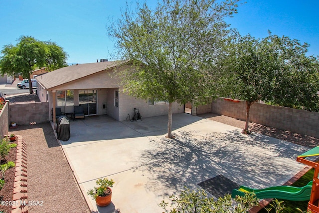 6075 N Applesauce Ct, Tucson, AZ 85741 - back of house with stucco siding, a patio area, and a fenced backyard