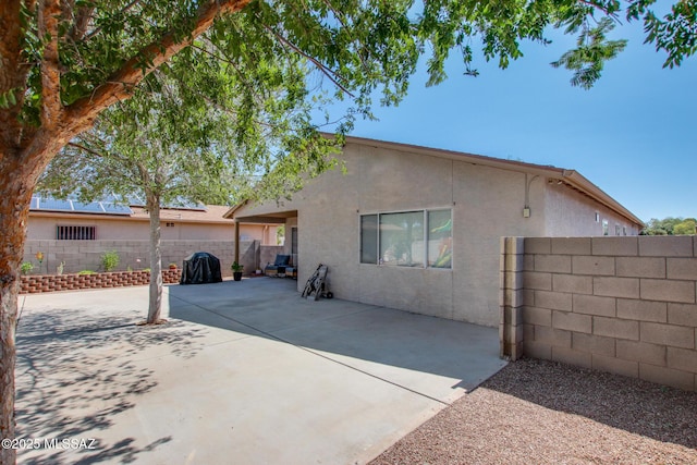6075 N Applesauce Ct, Tucson, AZ 85741 - back of property featuring stucco siding, a fenced backyard, and a patio area