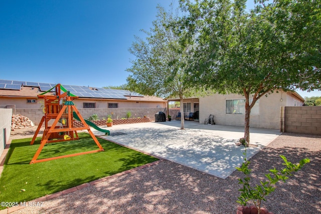 6075 N Applesauce Ct, Tucson, AZ 85741 - rear view of house with a playground, a patio area, a fenced backyard, and stucco siding