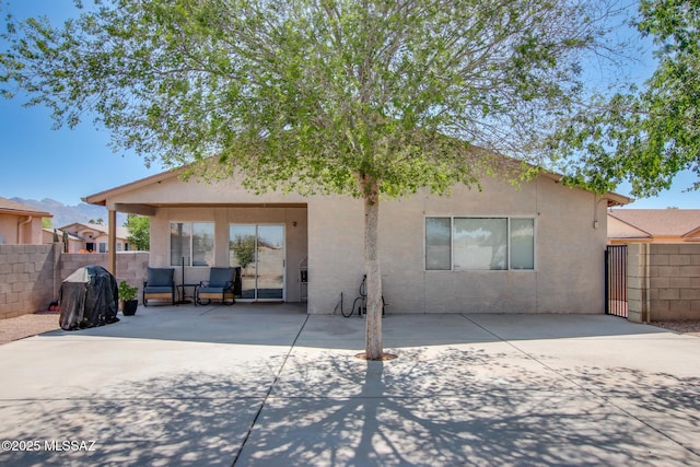6075 N Applesauce Ct, Tucson, AZ 85741 - rear view of house with a patio area and stucco siding