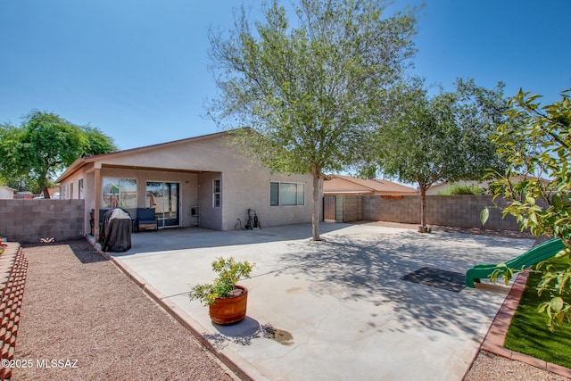 6075 N Applesauce Ct, Tucson, AZ 85741 - rear view of property featuring stucco siding, a fenced backyard, and a patio area