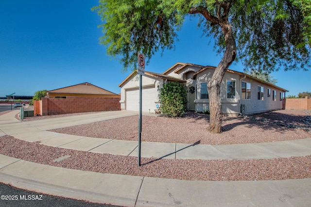 6075 N Applesauce Ct, Tucson, AZ 85741 - ranch-style home with an attached garage, concrete driveway, and stucco siding