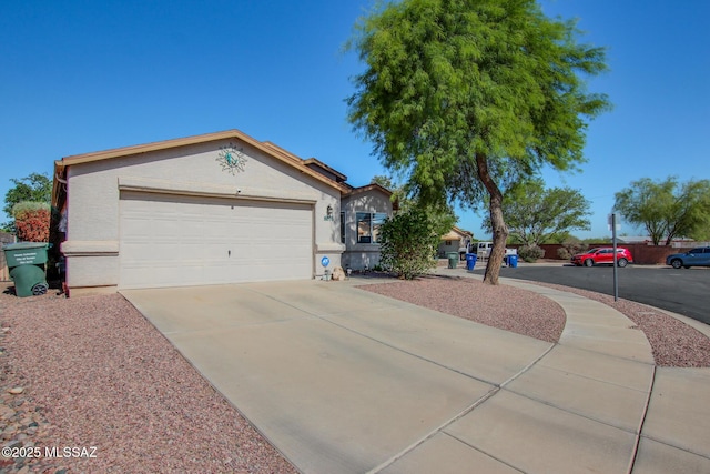 6075 N Applesauce Ct, Tucson, AZ 85741 - ranch-style house featuring concrete driveway, stucco siding, and an attached garage