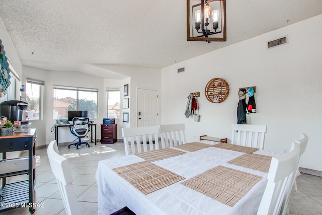 6075 N Applesauce Ct, Tucson, AZ 85741 - dining area featuring a textured ceiling, light tile patterned floors, an office area, and a chandelier