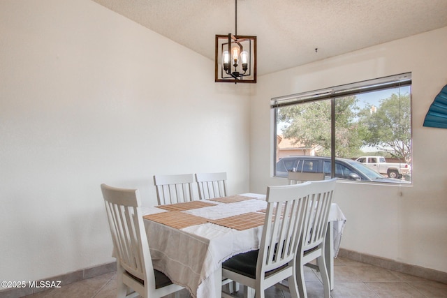 6075 N Applesauce Ct, Tucson, AZ 85741 - dining area with lofted ceiling, tile patterned flooring, a chandelier, and a textured ceiling