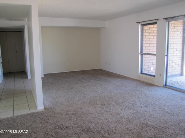 1001 E Irene St, Pearce, AZ 85625 - carpeted empty room with tile patterned flooring