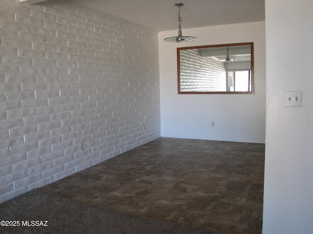 1001 E Irene St, Pearce, AZ 85625 - spare room featuring brick wall