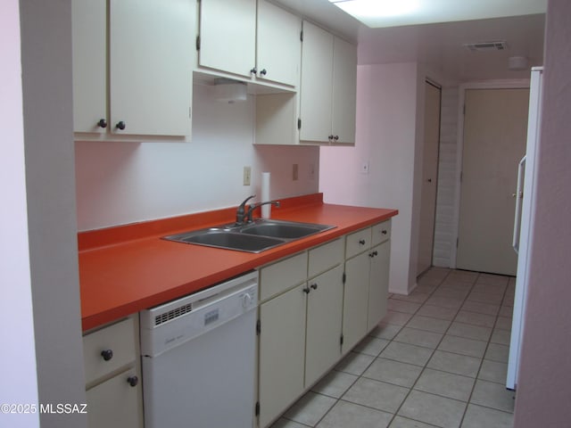 1001 E Irene St, Pearce, AZ 85625 - kitchen featuring white dishwasher, light tile patterned floors, white cabinets, and light countertops