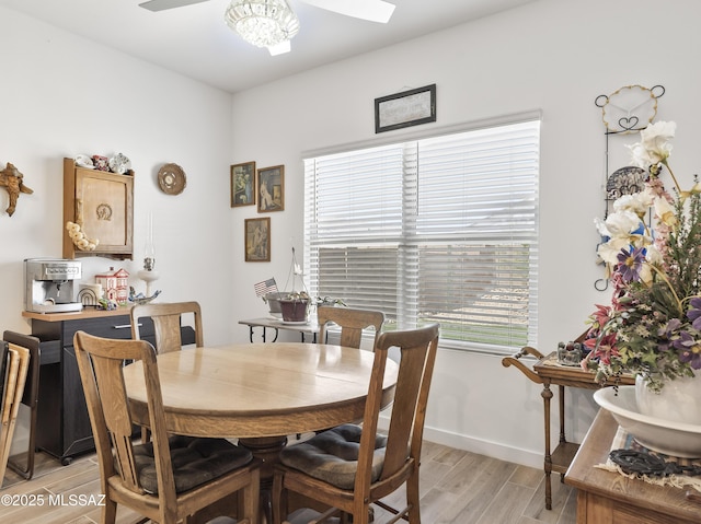 656 W Wilkinson St, Corona De Tucson, AZ 85641 - dining area with light wood finished floors and a ceiling fan