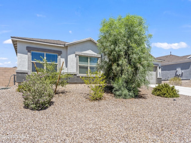 656 W Wilkinson St, Corona De Tucson, AZ 85641 - rear view of property featuring stucco siding and a garage
