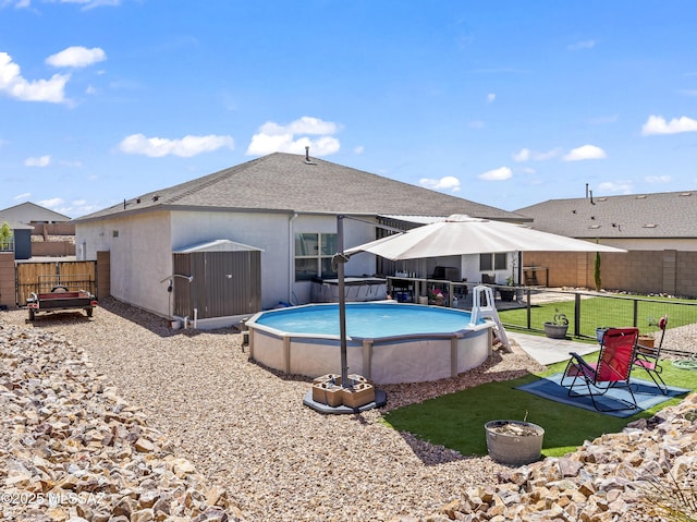 656 W Wilkinson St, Corona De Tucson, AZ 85641 - back of property featuring an outdoor pool and roof with shingles