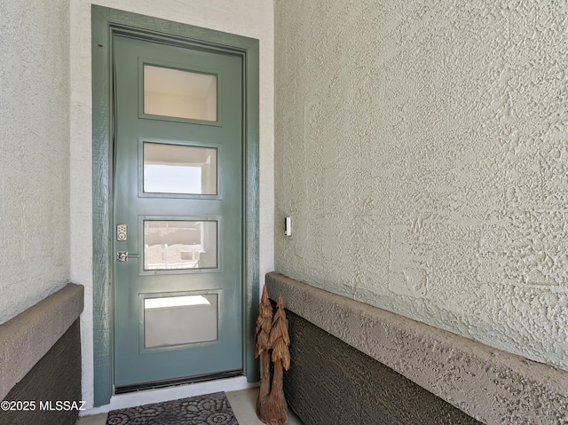 656 W Wilkinson St, Corona De Tucson, AZ 85641 - doorway to property with stucco siding