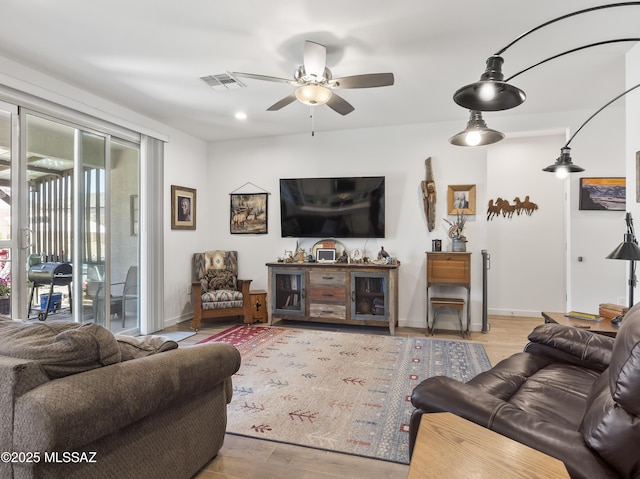 656 W Wilkinson St, Corona De Tucson, AZ 85641 - living room with wood finished floors and a ceiling fan