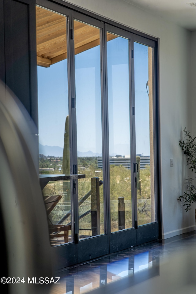 5051 N Hillcrest Dr, Tucson, AZ 85704 - doorway to outside featuring baseboards and a mountain view