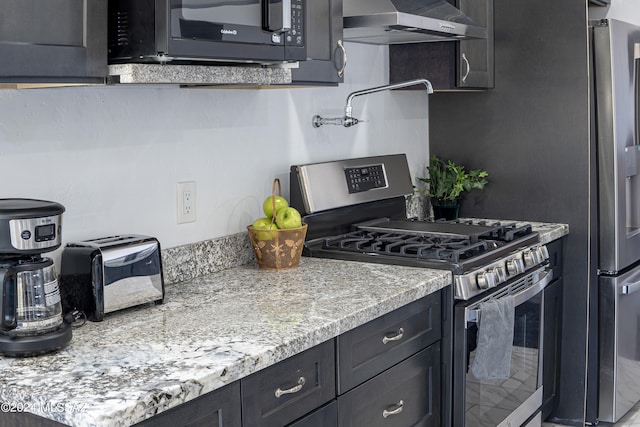 5051 N Hillcrest Dr, Tucson, AZ 85704 - kitchen with gas range, range hood, and dark cabinets