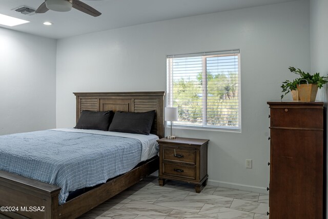 5051 N Hillcrest Dr, Tucson, AZ 85704 - bedroom with light marble finish floors, recessed lighting, and ceiling fan