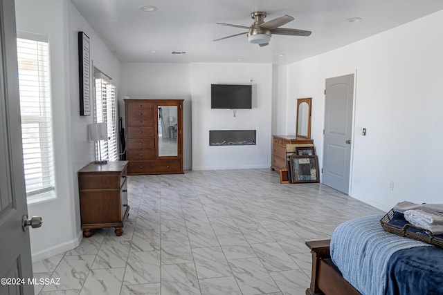 5051 N Hillcrest Dr, Tucson, AZ 85704 - living area with light marble finish floors, ceiling fan, plenty of natural light, and recessed lighting
