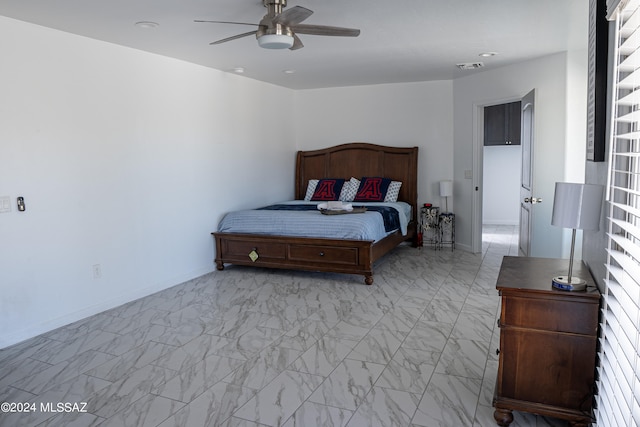 5051 N Hillcrest Dr, Tucson, AZ 85704 - bedroom with a ceiling fan and light marble finish floors
