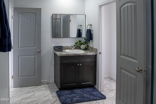 5051 N Hillcrest Dr, Tucson, AZ 85704 - bathroom with marble look tiles and vanity