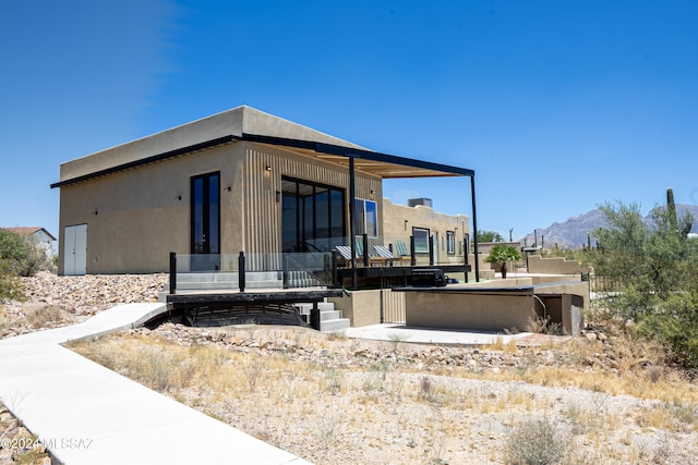 5051 N Hillcrest Dr, Tucson, AZ 85704 - view of home's exterior with a mountain view and stucco siding