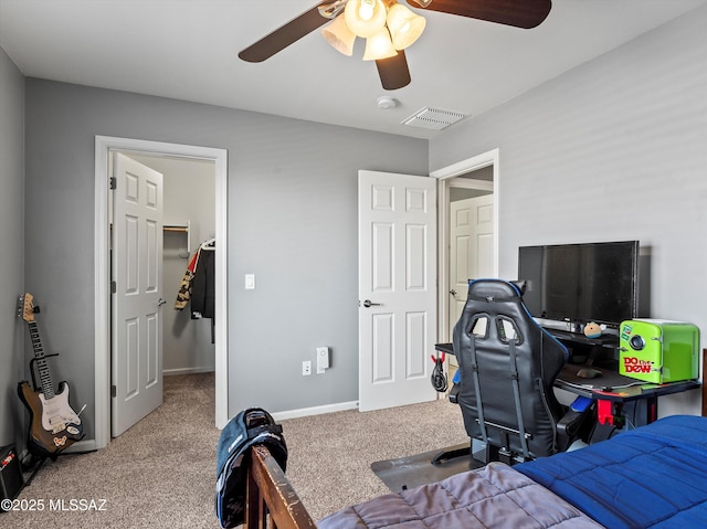 11471 E Squash Blossom Loop, Tucson, AZ 85747 - bedroom featuring carpet floors, a walk in closet, and ceiling fan