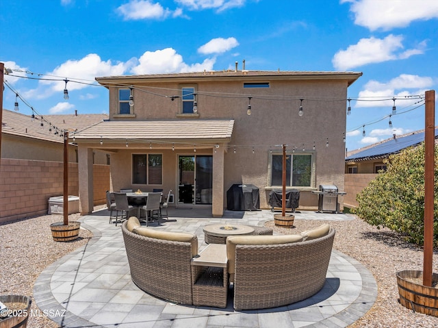 11471 E Squash Blossom Loop, Tucson, AZ 85747 - fenced backyard with a fire pit, a patio, and a grill