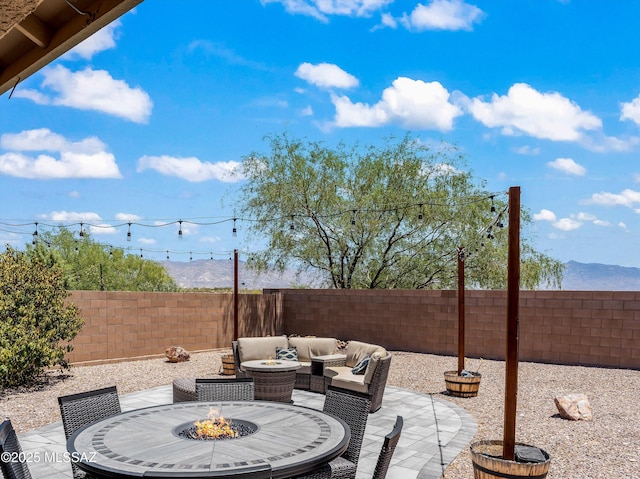 11471 E Squash Blossom Loop, Tucson, AZ 85747 - fenced backyard featuring a fire pit and a patio area