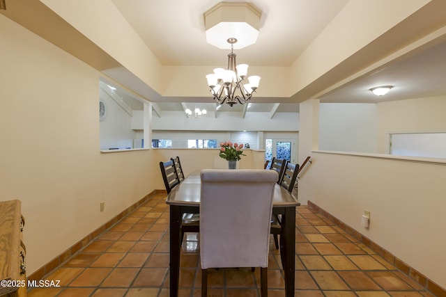 2000 E Campbell Ter, Tucson, AZ 85718 - tiled dining area featuring a chandelier and baseboards
