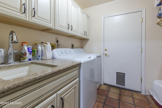 2000 E Campbell Ter, Tucson, AZ 85718 - laundry area with washing machine and dryer, cabinet space, and tile patterned floors