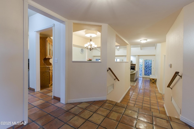 2000 E Campbell Ter, Tucson, AZ 85718 - hallway with an upstairs landing and a chandelier