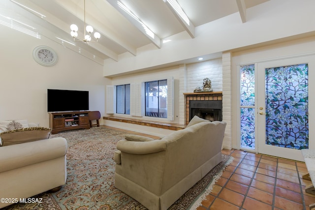 2000 E Campbell Ter, Tucson, AZ 85718 - tiled living area featuring a chandelier, beamed ceiling, a fireplace, and high vaulted ceiling