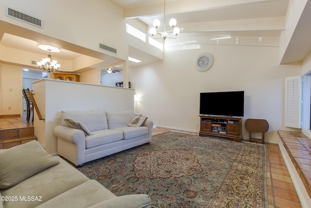 2000 E Campbell Ter, Tucson, AZ 85718 - tiled living area with a chandelier, a towering ceiling, and beam ceiling