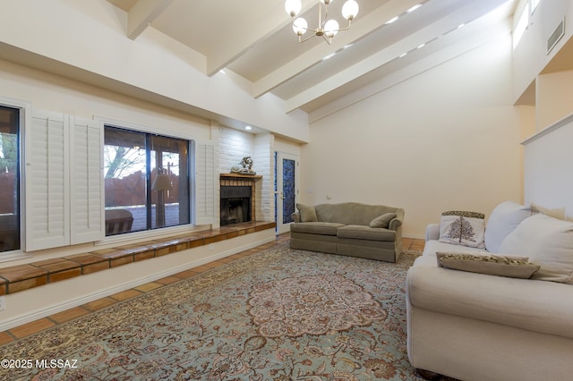 2000 E Campbell Ter, Tucson, AZ 85718 - living area with beam ceiling, a chandelier, a fireplace with raised hearth, tile patterned floors, and high vaulted ceiling