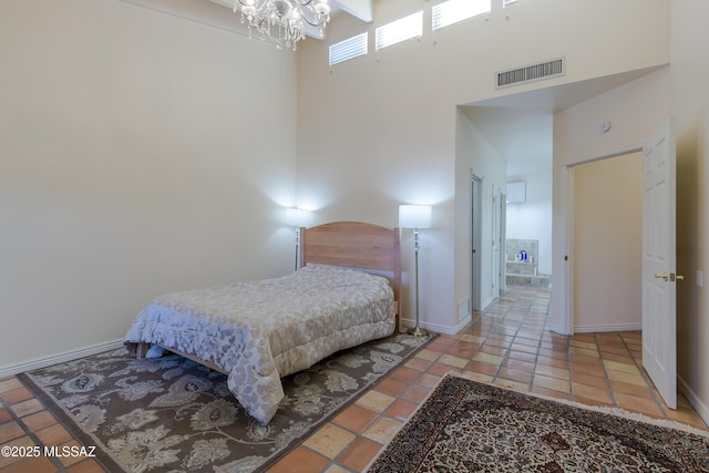 2000 E Campbell Ter, Tucson, AZ 85718 - bedroom featuring a towering ceiling and a chandelier