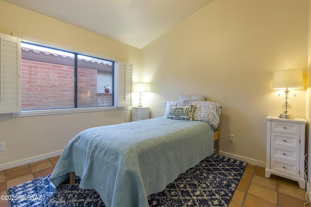 2000 E Campbell Ter, Tucson, AZ 85718 - bedroom featuring tile patterned flooring and lofted ceiling