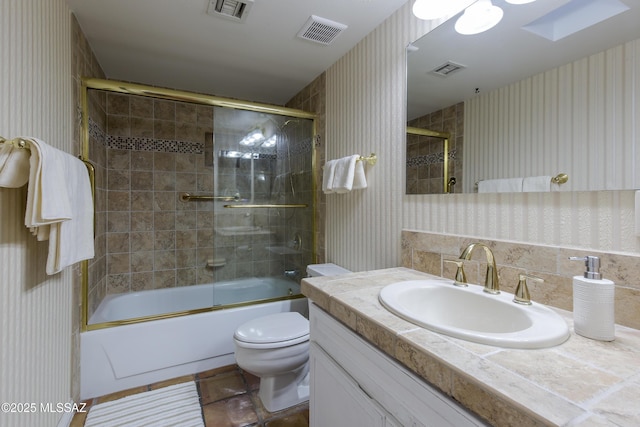 2000 E Campbell Ter, Tucson, AZ 85718 - bathroom featuring wallpapered walls, vanity, bath / shower combo with glass door, and tile patterned flooring
