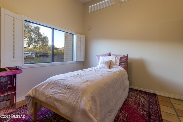 2000 E Campbell Ter, Tucson, AZ 85718 - tiled bedroom featuring baseboards