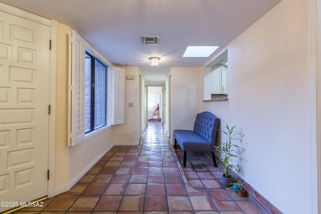 2000 E Campbell Ter, Tucson, AZ 85718 - hallway featuring a skylight and tile patterned floors