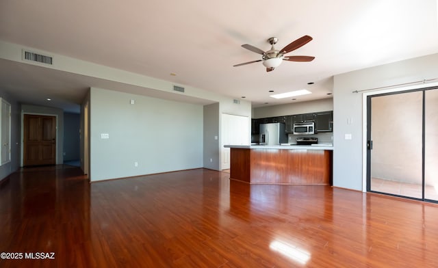 2990 W Trevi Pl Unit 200, Tucson, AZ 85741 - unfurnished living room with ceiling fan and wood finished floors