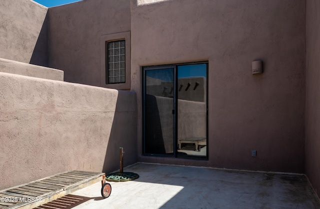 2990 W Trevi Pl Unit 200, Tucson, AZ 85741 - property entrance with stucco siding and a patio