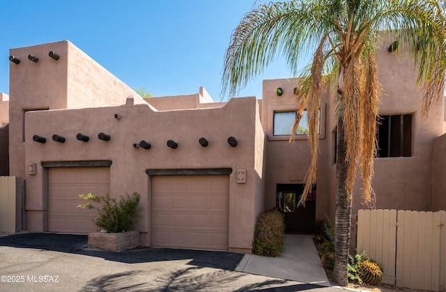 2990 W Trevi Pl Unit 200, Tucson, AZ 85741 - adobe home featuring a garage
