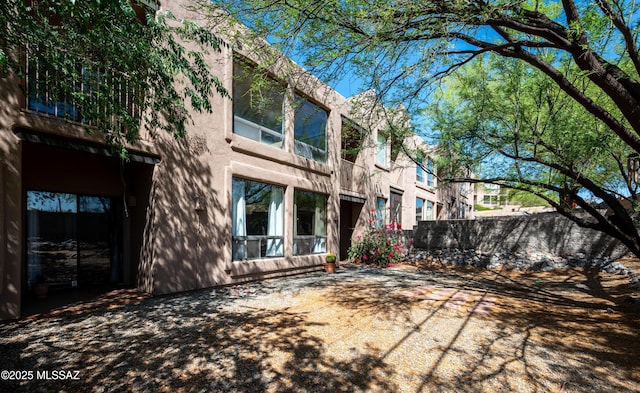 2990 W Trevi Pl Unit 200, Tucson, AZ 85741 - back of property with stucco siding and a balcony