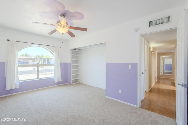 2366 N Camino Mateo, Tucson, AZ 85745 - carpeted spare room featuring a ceiling fan and baseboards