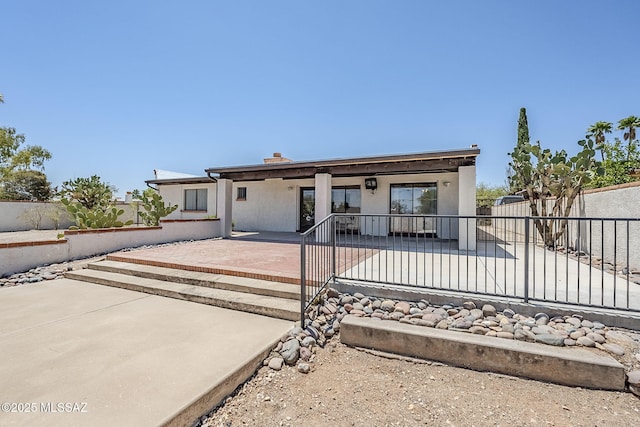 2366 N Camino Mateo, Tucson, AZ 85745 - view of front of home featuring a patio and stucco siding